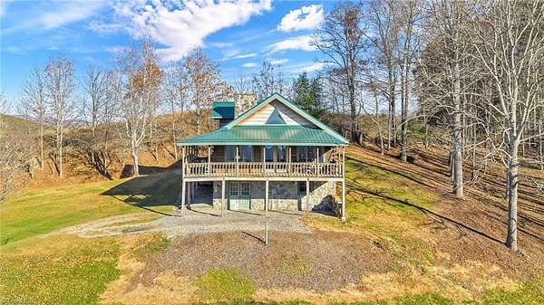 3.1 Acres of Land with Home for Sale in Grassy Creek, North Carolina