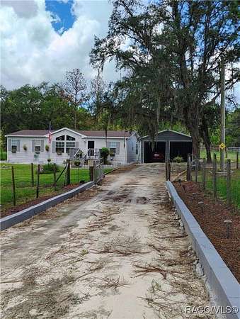 2.52 Acres of Residential Land with Home for Sale in Dunnellon, Florida