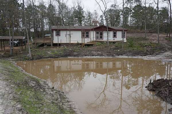 6.12 Acres of Land with Home for Sale in Palestine, Texas