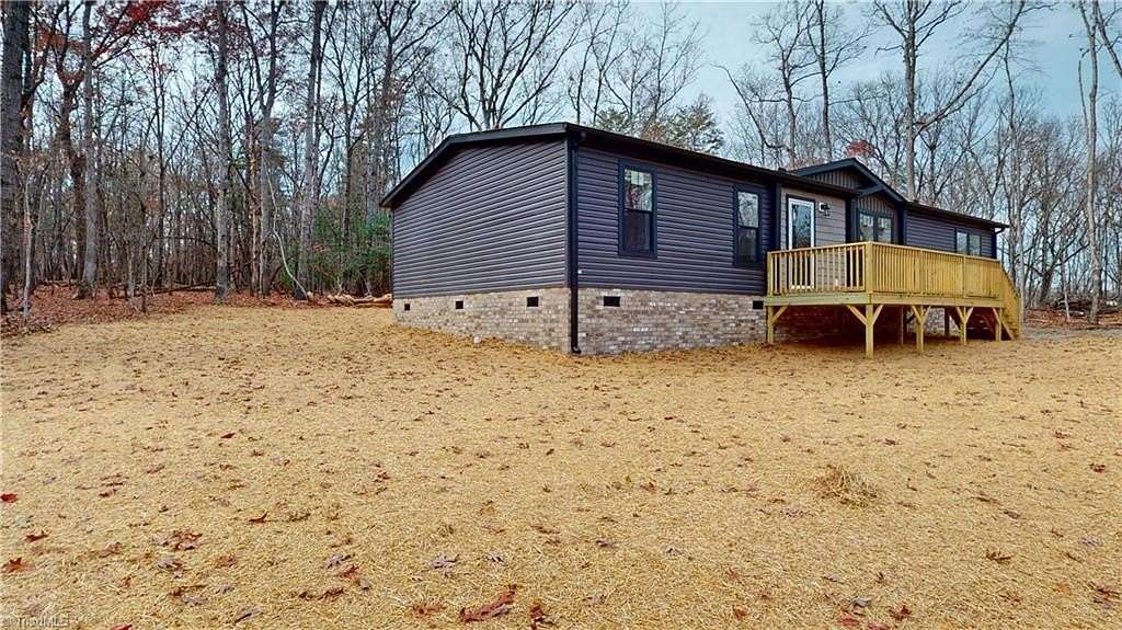 3.5 Acres of Residential Land with Home for Sale in State Road, North Carolina