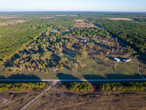 33 Acres of Land with Home for Sale in Bedias, Texas