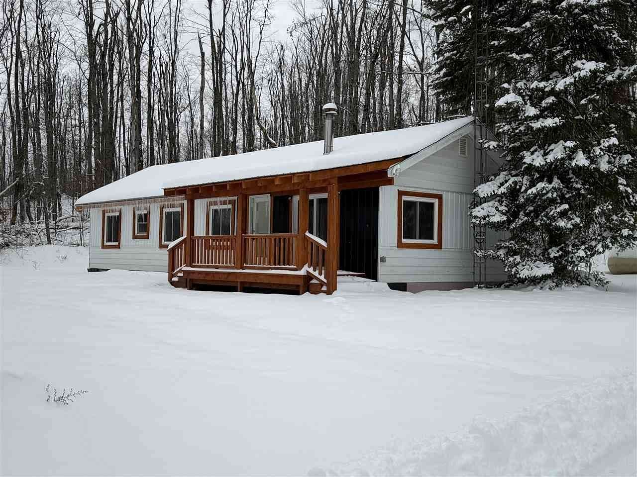 5 Acres of Residential Land with Home for Sale in Boyne Falls, Michigan