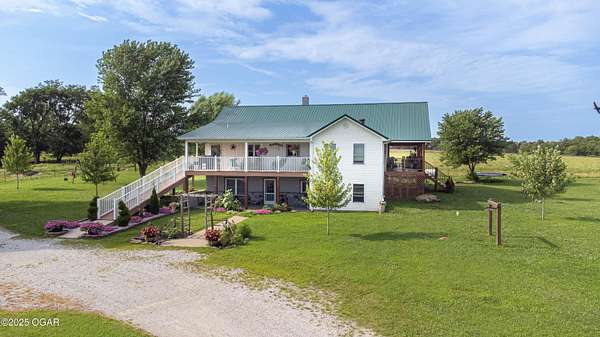 57 Acres of Land with Home for Sale in Lamar, Missouri