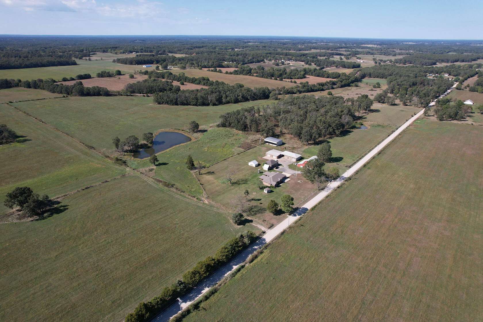 250 Acres of Agricultural Land with Home for Sale in Phillipsburg, Missouri