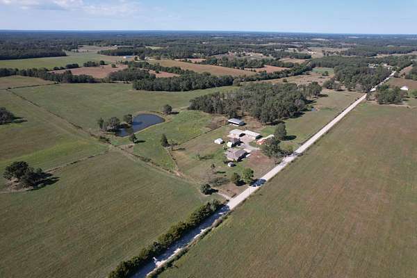 250 Acres of Agricultural Land with Home for Sale in Phillipsburg, Missouri