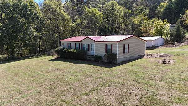 27.1 Acres of Recreational Land with Home for Auction in Bethpage, Tennessee