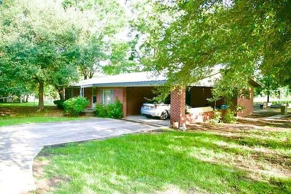 2 Acres of Residential Land with Home for Sale in Corrigan, Texas