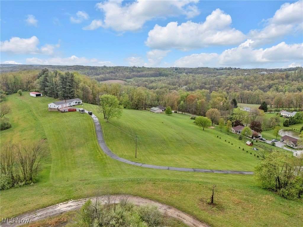 6.32 Acres of Residential Land with Home for Auction in Millersburg, Ohio