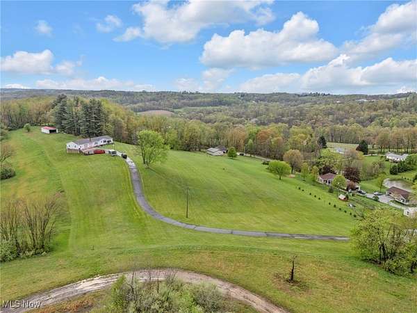 6.32 Acres of Residential Land with Home for Auction in Millersburg, Ohio