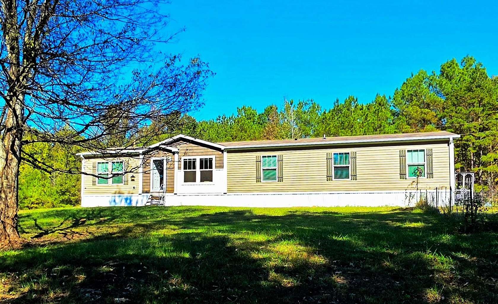 15.4 Acres of Land with Home for Sale in Michie, Tennessee
