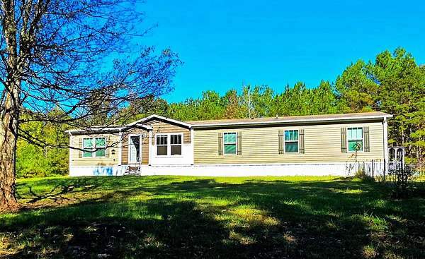 15.4 Acres of Land with Home for Sale in Michie, Tennessee