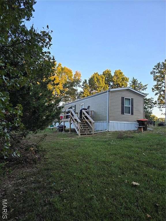 2.14 Acres of Residential Land with Home for Sale in Stoutland, Missouri