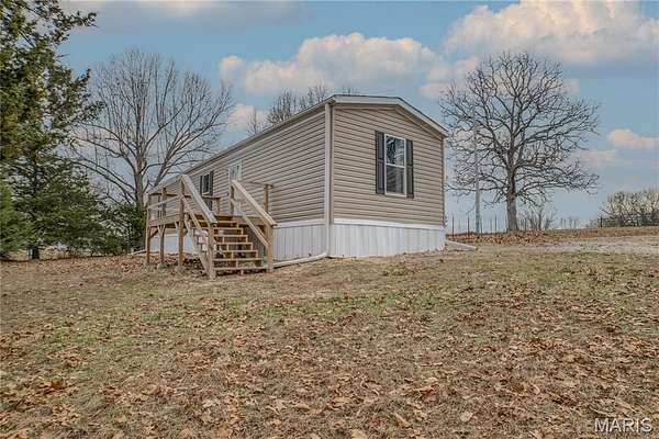 2.14 Acres of Residential Land with Home for Sale in Stoutland, Missouri