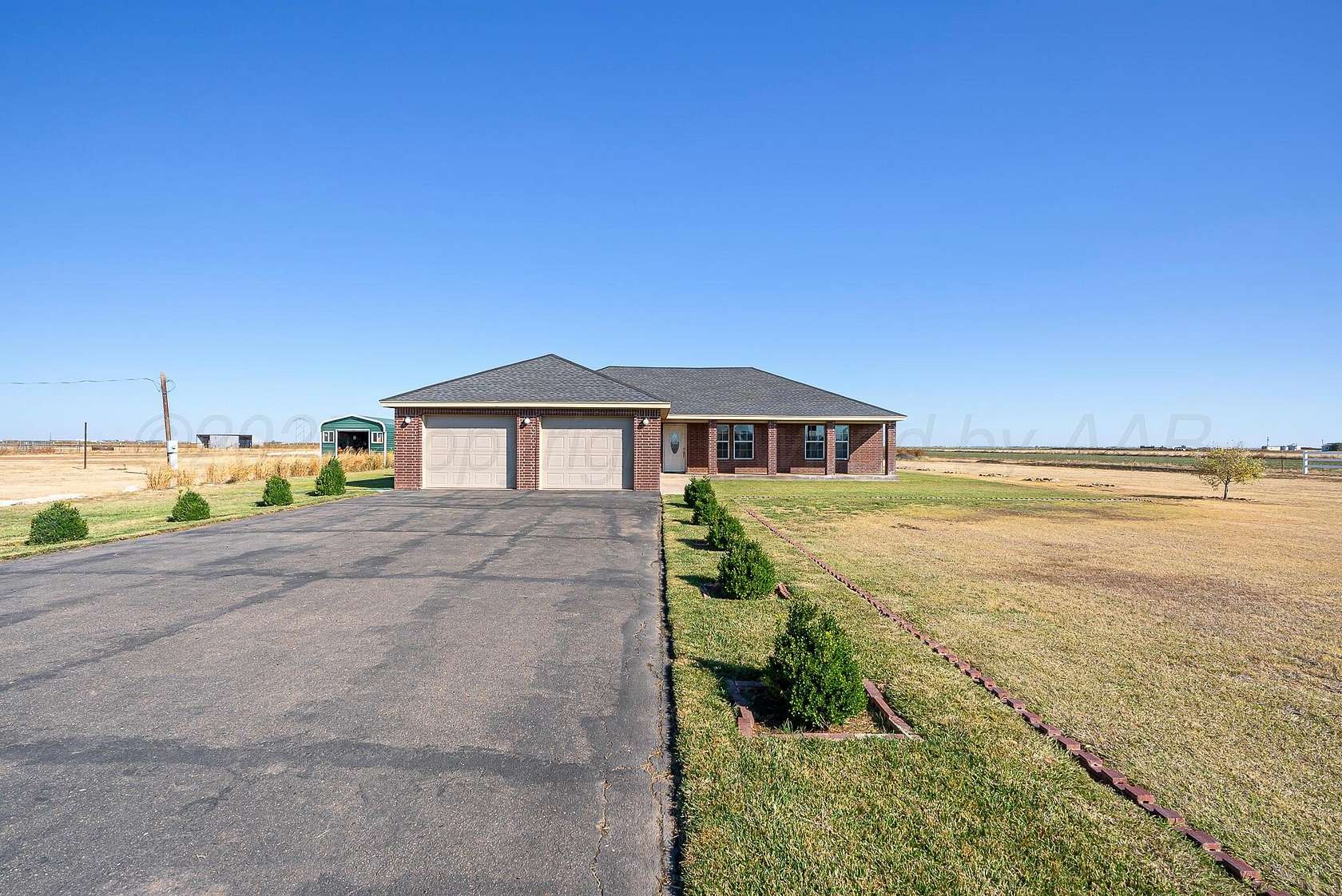 4.7 Acres of Residential Land with Home for Sale in Canyon, Texas