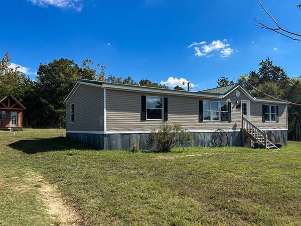 1.5 Acres of Residential Land with Home for Sale in Clarkridge, Arkansas