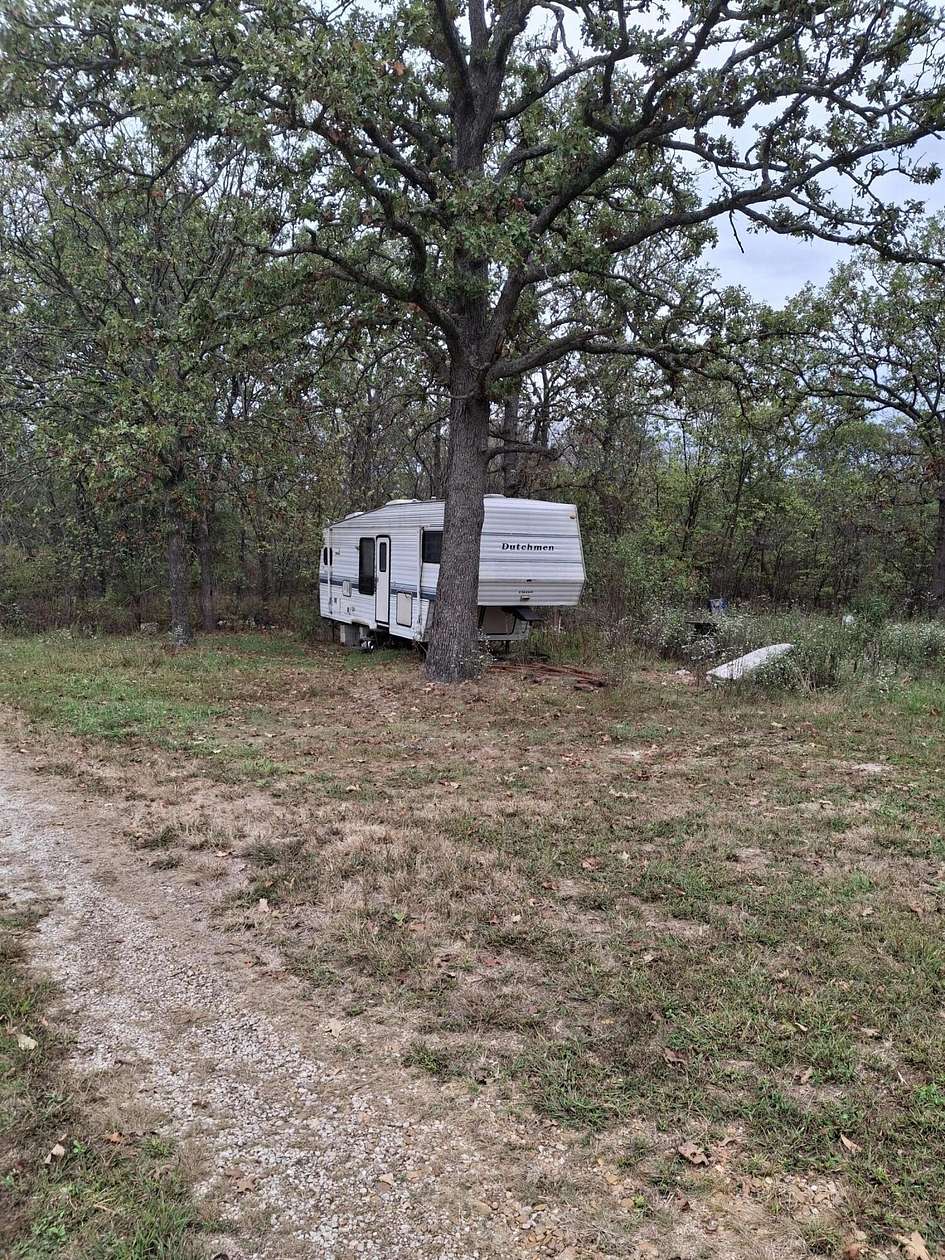 12.2 Acres of Land with Home for Sale in Humansville, Missouri