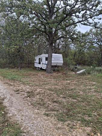 12.2 Acres of Land with Home for Sale in Humansville, Missouri