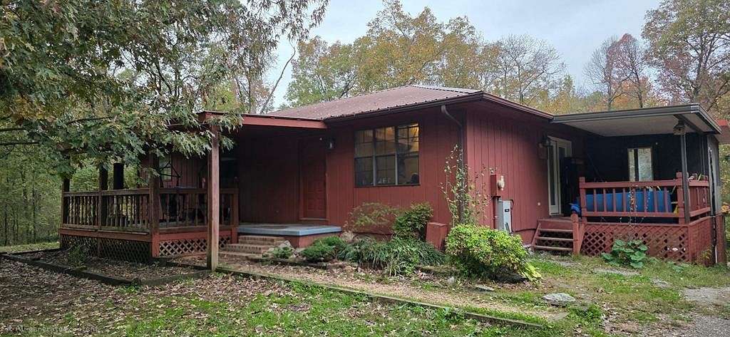 3.76 Acres of Residential Land with Home for Sale in Camden, Tennessee