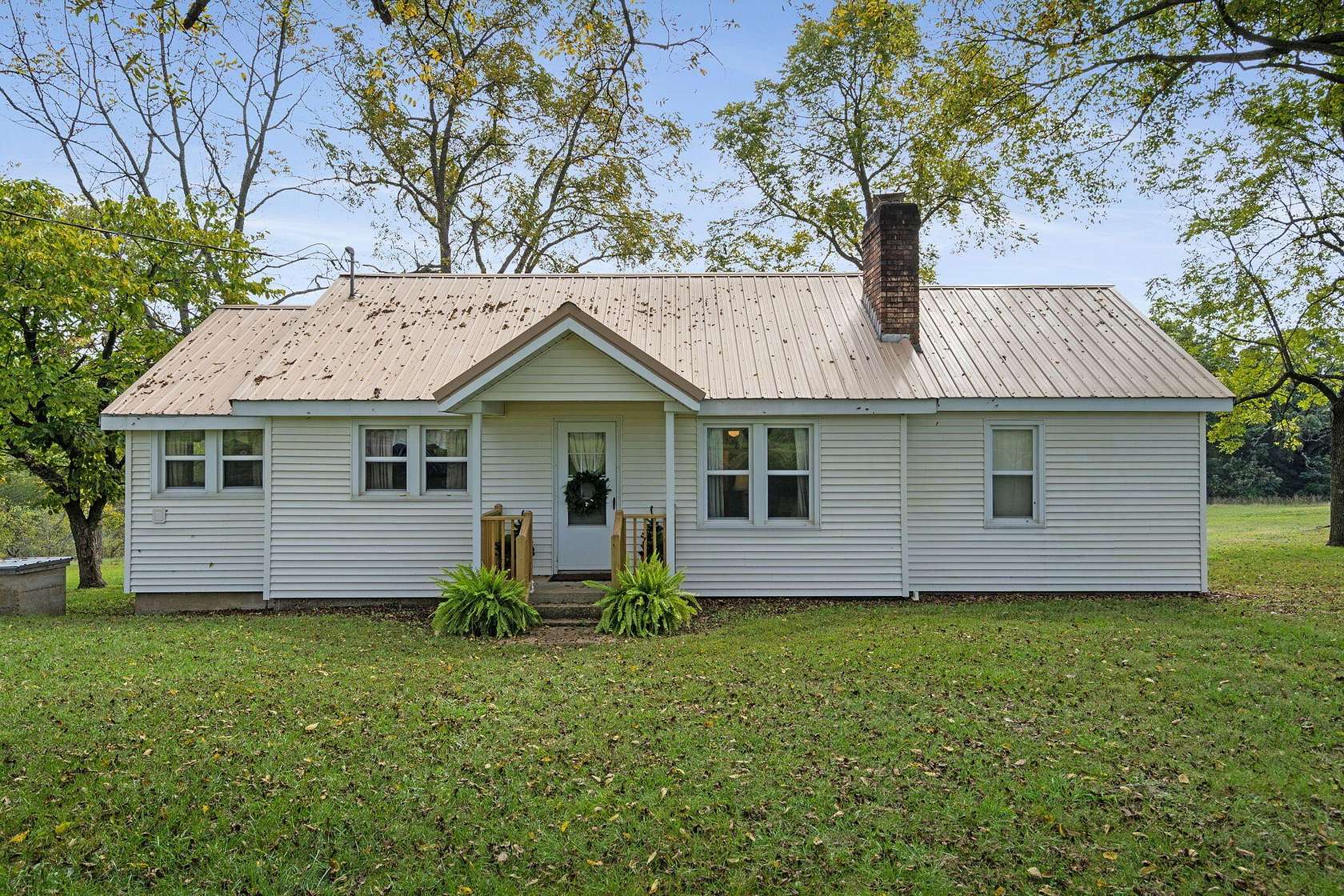 9 Acres of Residential Land with Home for Sale in Lampe, Missouri