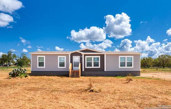 9.7 Acres of Residential Land with Home for Sale in Devine, Texas