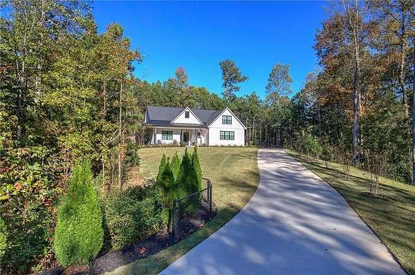 1.69 Acres of Residential Land with Home for Sale in Ball Ground, Georgia