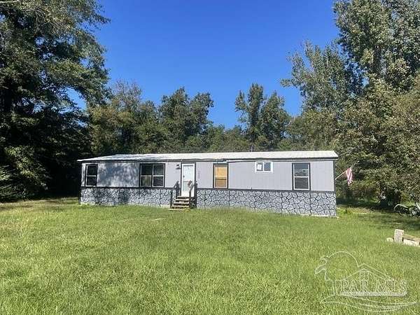 4 Acres of Residential Land with Home for Sale in Century, Florida