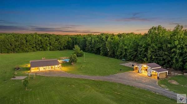 33.3 Acres of Agricultural Land with Home for Sale in De Kalb, Texas