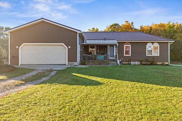 5 Acres of Residential Land with Home for Sale in Sheridan, Michigan