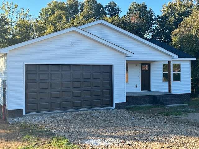 0.67 Acres of Residential Land with Home for Sale in Hohenwald, Tennessee