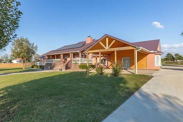 5 Acres of Land with Home for Sale in Lowell, Arkansas