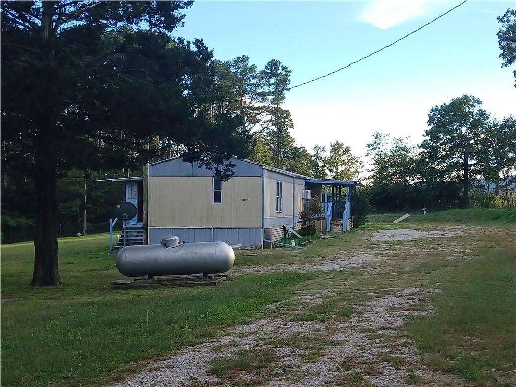 1.62 Acres of Residential Land with Home for Sale in Berryville, Arkansas