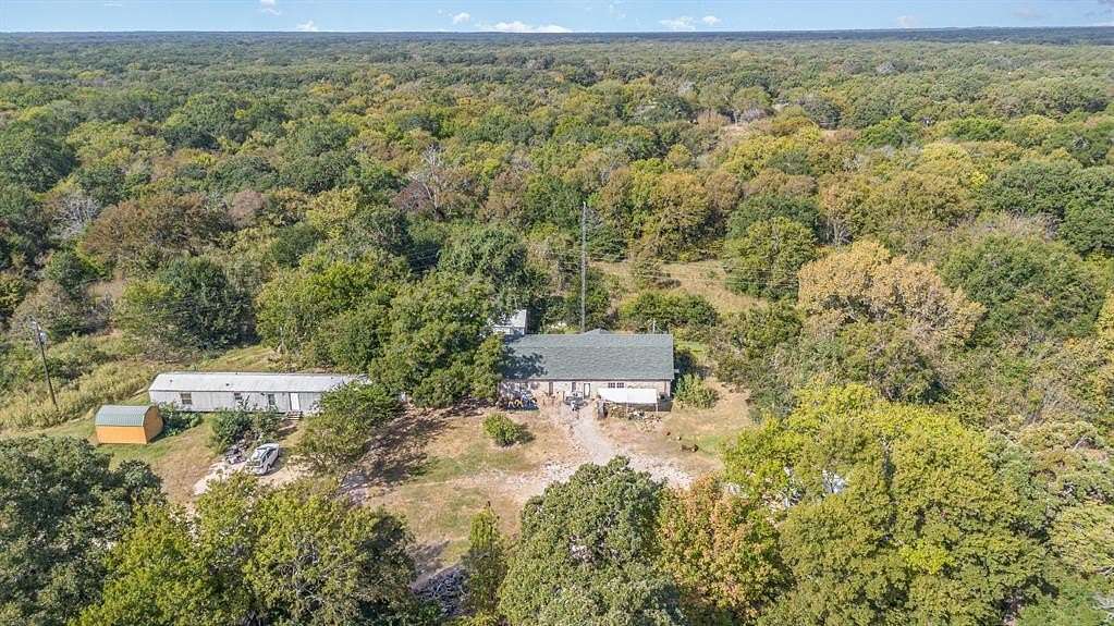 6.7 Acres of Residential Land with Home for Sale in Quinlan, Texas