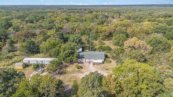 6.7 Acres of Residential Land with Home for Sale in Quinlan, Texas