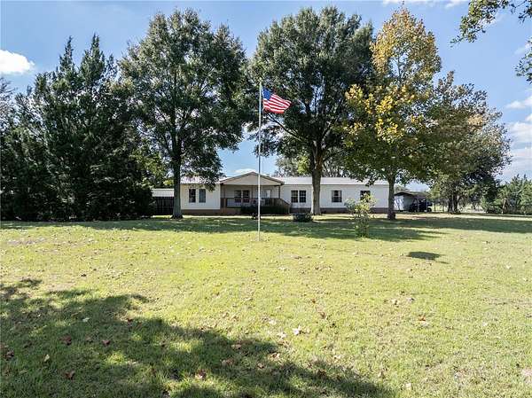 43.8 Acres of Agricultural Land with Home for Sale in Morriston, Florida