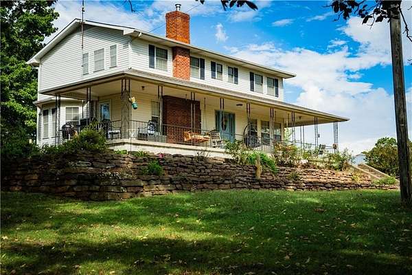 275 Acres of Land with Home for Sale in Stilwell, Oklahoma