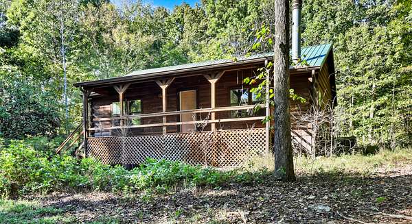 3 Acres of Residential Land with Home for Auction in Indian Mound, Tennessee