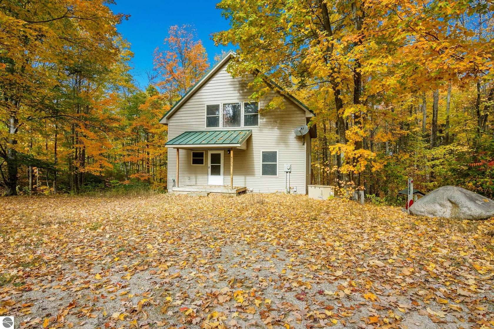 10.5 Acres of Recreational Land with Home for Sale in Mancelona, Michigan