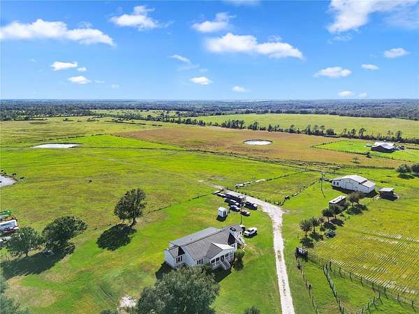 83.8 Acres of Agricultural Land with Home for Sale in Ona, Florida