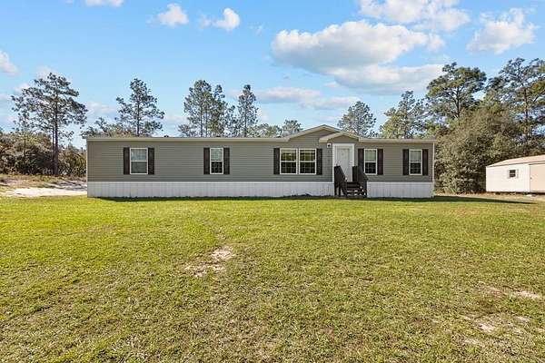 1.84 Acres of Residential Land with Home for Sale in Morriston, Florida