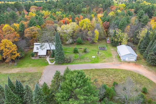 3 Acres of Residential Land with Home for Sale in Minocqua, Wisconsin
