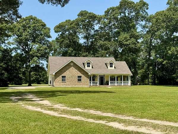 6.54 Acres of Residential Land with Home for Sale in Spurger, Texas