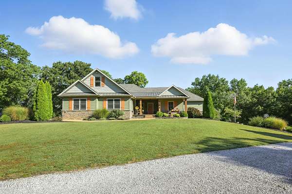 32 Acres of Recreational Land with Home for Sale in Carl Junction, Missouri