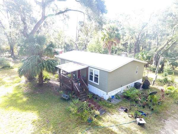 2.5 Acres of Residential Land with Home for Sale in Chiefland, Florida