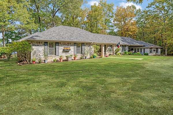 5.86 Acres of Residential Land with Home for Sale in Powderly, Texas