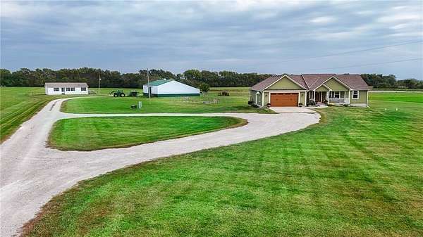 41.4 Acres of Agricultural Land with Home for Sale in Freeman, Missouri