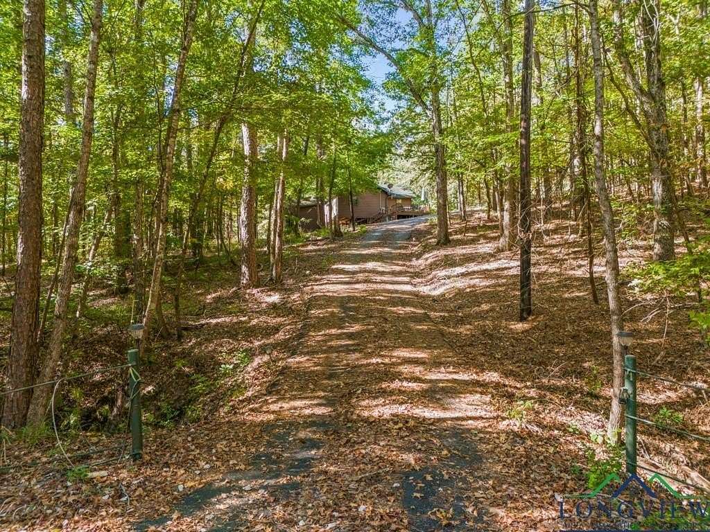 10 Acres of Recreational Land with Home for Sale in Avinger, Texas