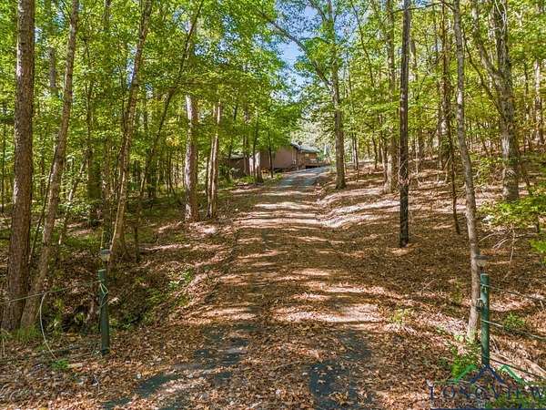 10 Acres of Recreational Land with Home for Sale in Avinger, Texas