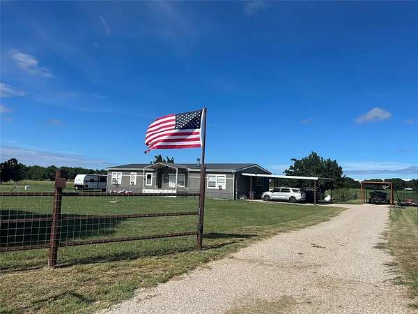 2 Acres of Residential Land with Home for Sale in Loving, Texas