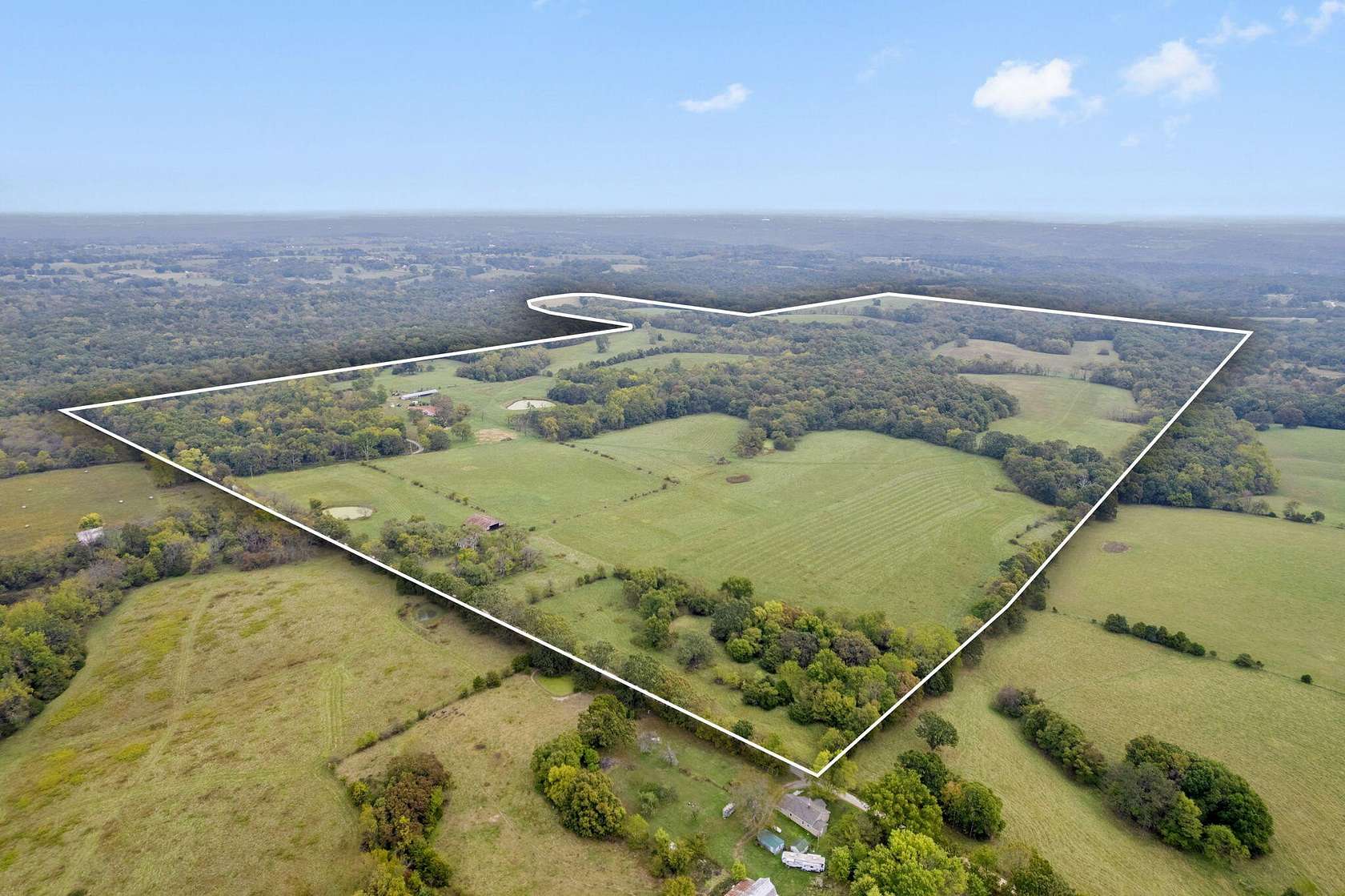 385 Acres of Agricultural Land with Home for Sale in Clever, Missouri