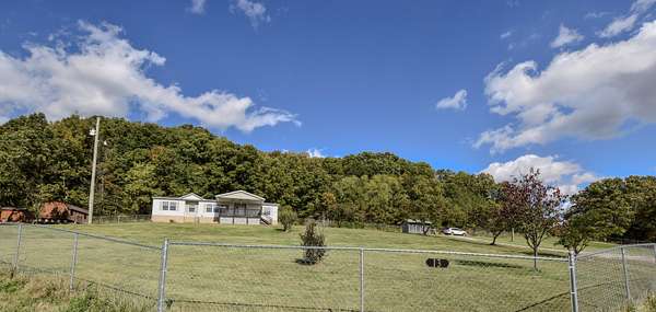 12.2 Acres of Land with Home for Sale in Flemingsburg, Kentucky